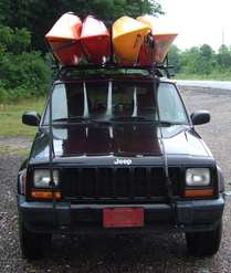 stacked jeep w/ 4 kayaks
