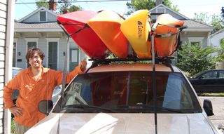 Some goof, a jeep and 4 kayaks